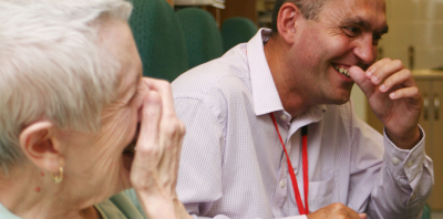 A man and woman laughing together