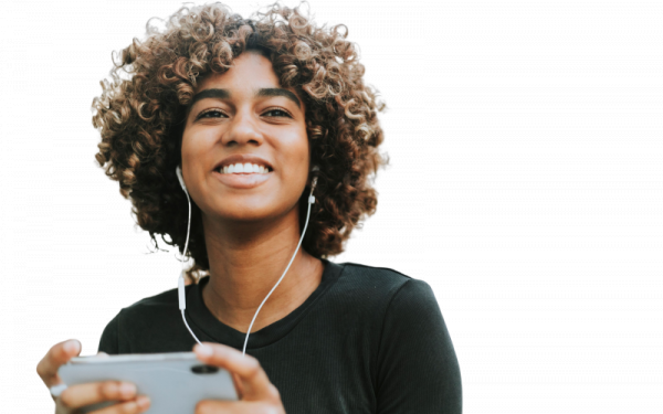 happy woman listening to something on headphones