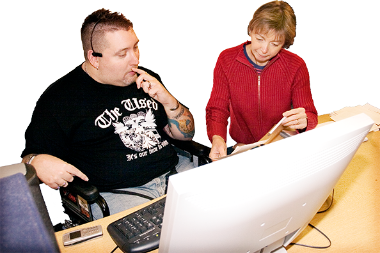 A man with a learning disability and his mentor sitting at a computer