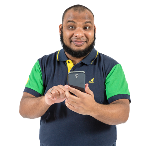Smiling man sending a text