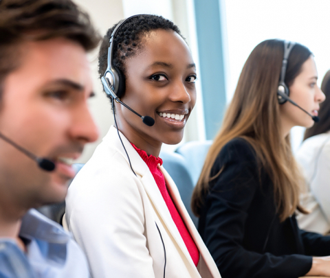 woman in a call centre smiling