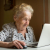 older woman at a computer